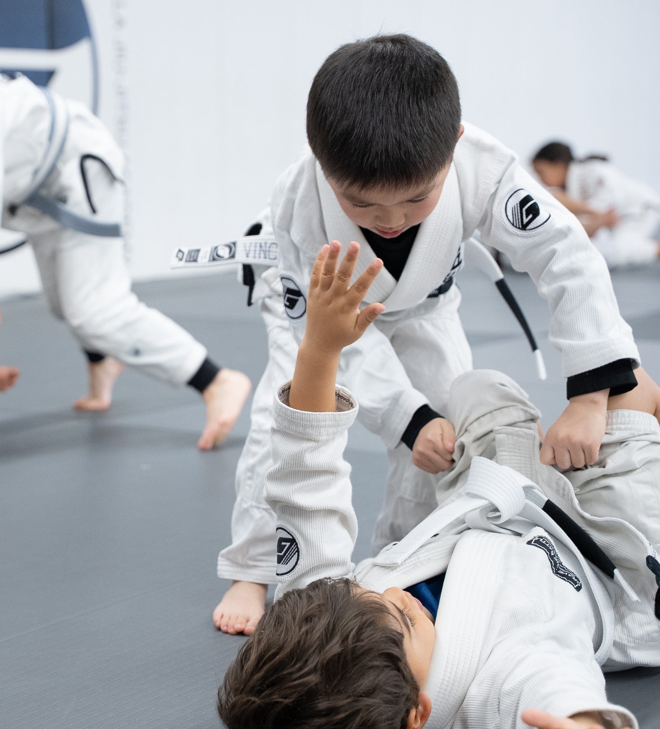 5-to-7-year-old-bjj-beginners-jiu-jitsu kids drilling jiu-jitsu in San Jose with partners