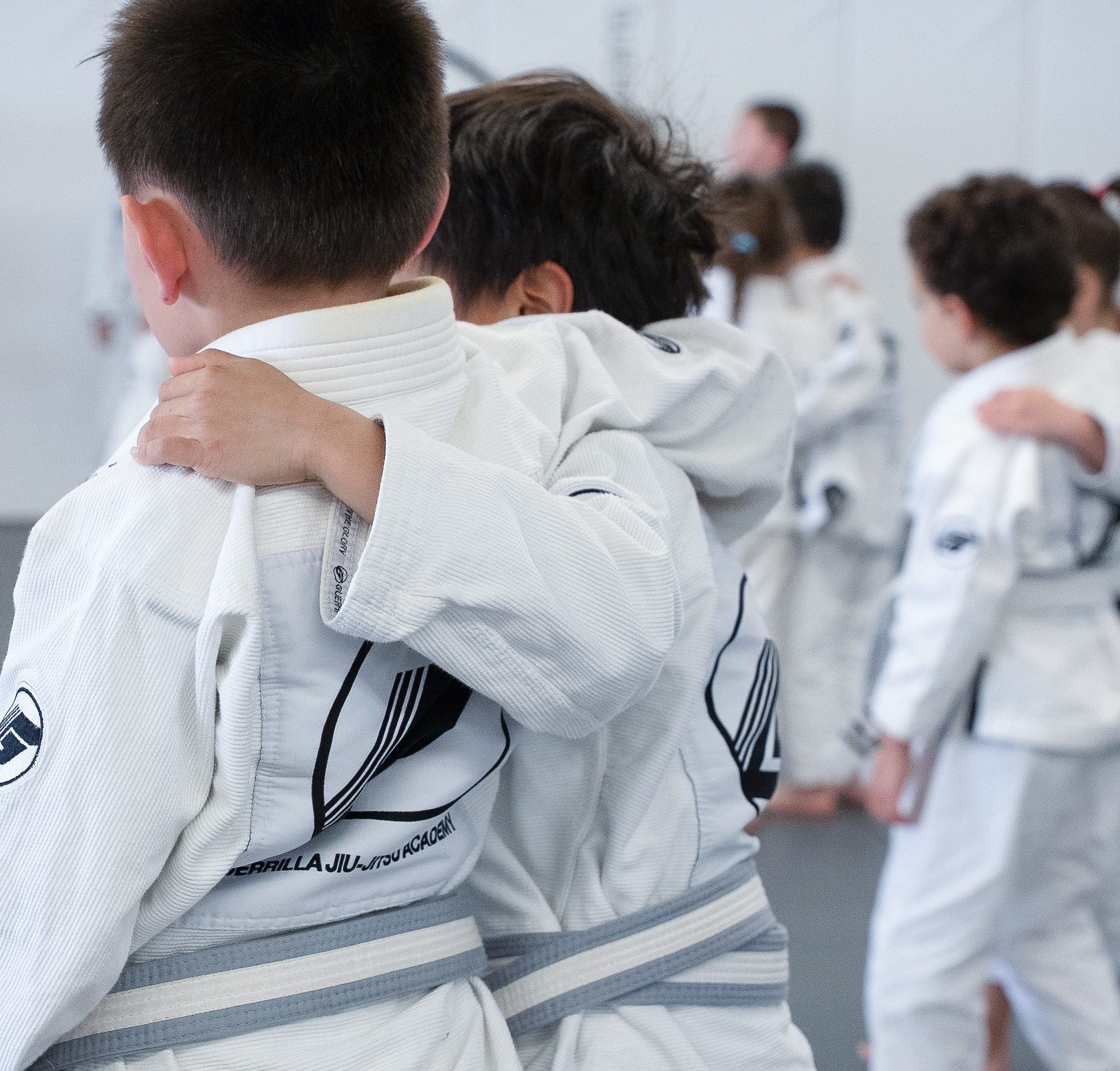 boys-in-5-to-7-year-old-bjj-class Teamwork in 5 to 7 year old BJJ class in San Jose